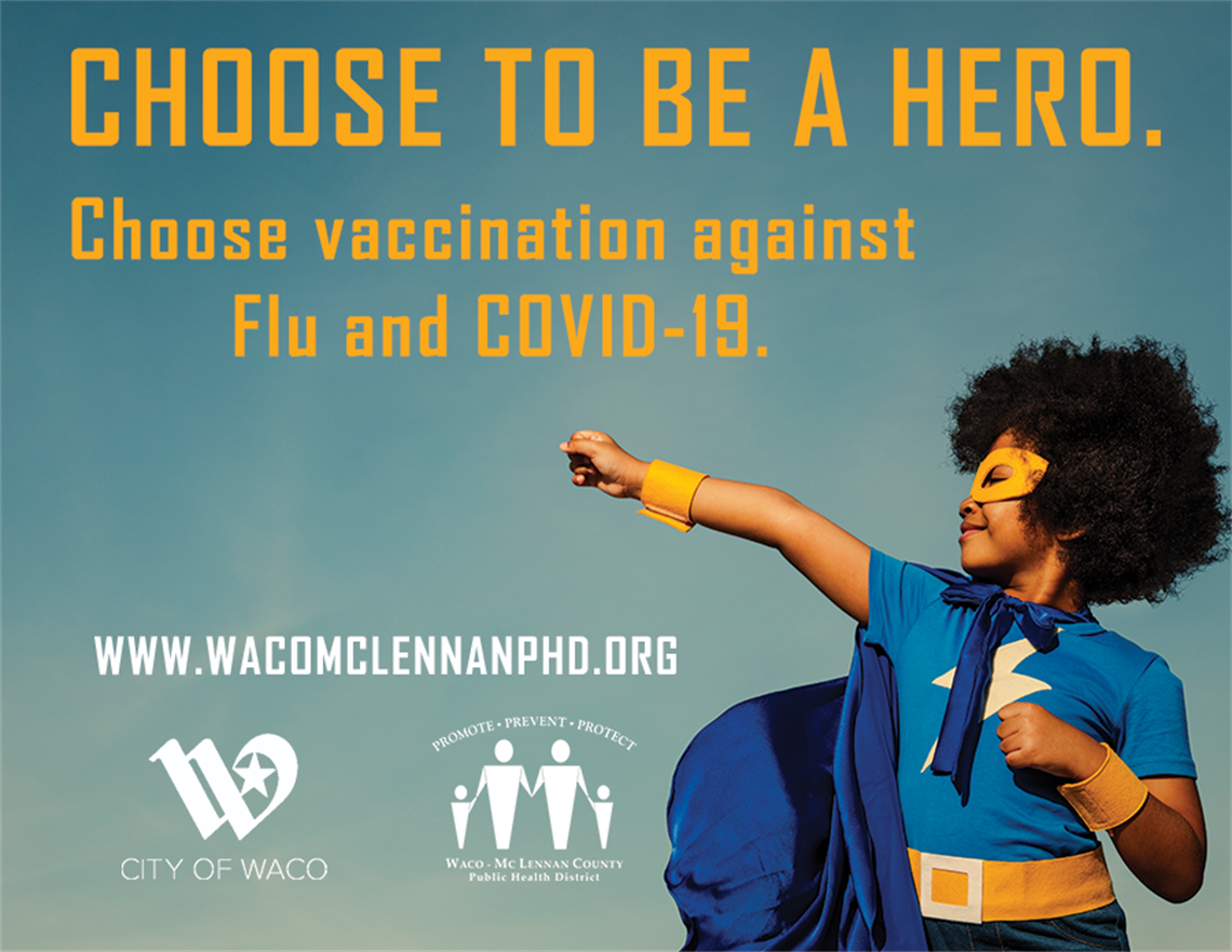 Child in a superhero costume encouraging everyone to get their flu and covid vaccines.