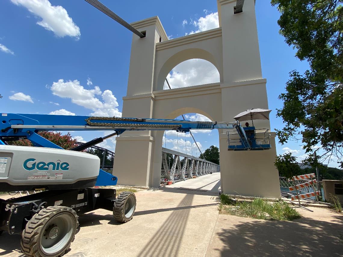 Photo of construction work on the Waco Suspension Bridge.
