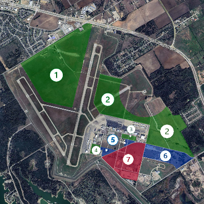 Aerial photo of the airport with color and number designations of the the aeronautical, non-aeronautical, and fair trade zone tracts available.