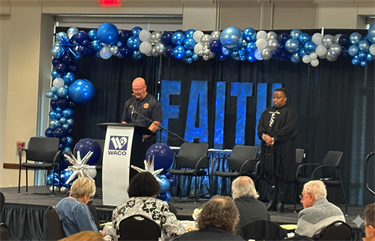 Captain Tracy Blackshear leading the welcoming prayer