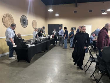 Attendees making their way through the buffet line