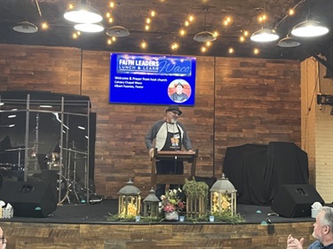 Pastor Albert Fuentes providing a welcoming prayer