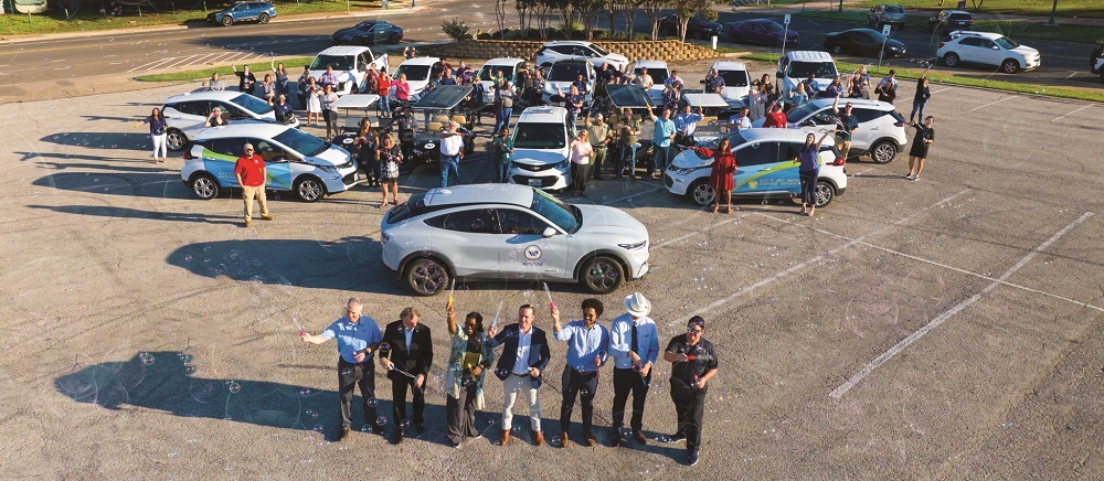 City leaders and staff with the fleet of electric vehicles