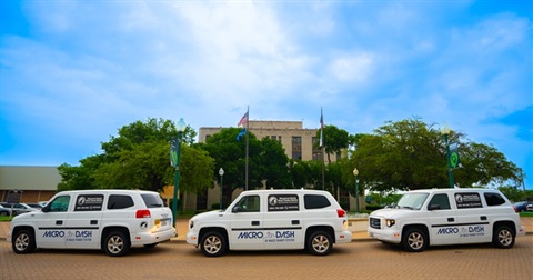 Three Transit MicroDash vehicles parked in front of Waco City Hall