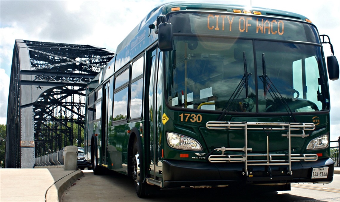A Waco Transit System bus driving across Washington Street Bridge in Waco, Texas.
