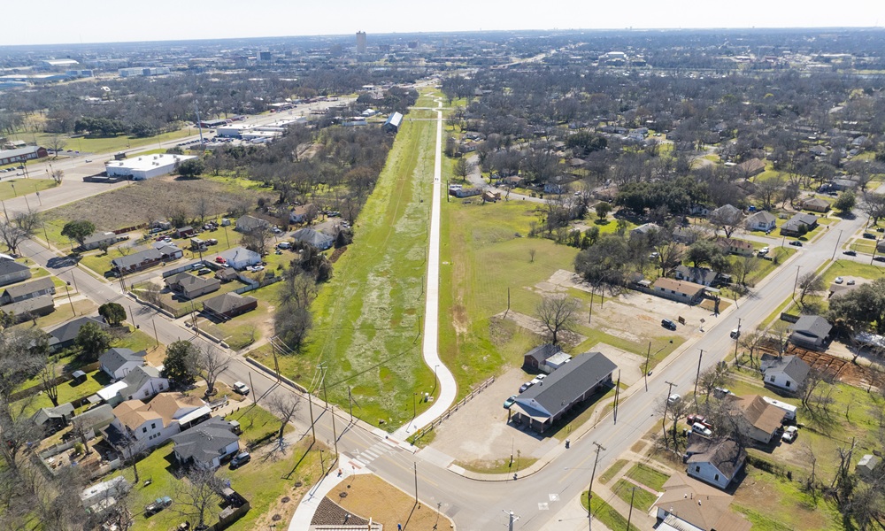 Aerial view of the MKT Trail surrounded by a neighborhood and trees