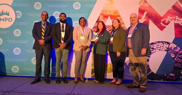 MPO staff receive award on stage