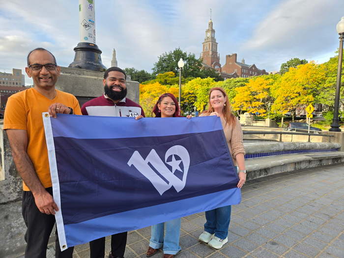 MPO staff holding City of Waco flag in Providence, Rhode Island
