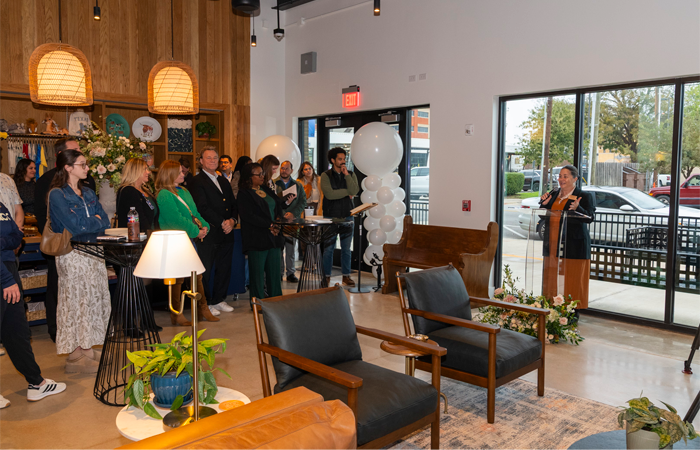 Lisa Blackmon speaking at the podium during Welcome Center grand opening