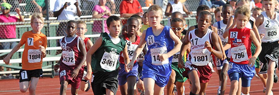 Children competing in a track race.